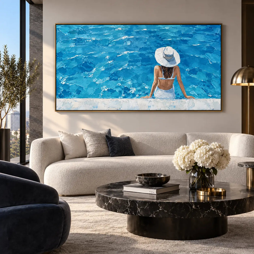 The Wide Blue Afternoon: above a rounded cream sofa with a dark cylindrical stone table