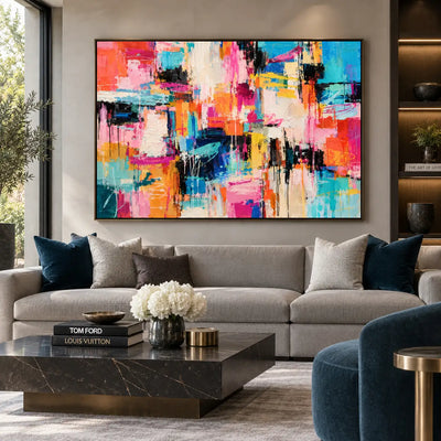 Turquoise Between Bright Blocks: above a cream sofa with blue cushions beside a blue lounge chair
