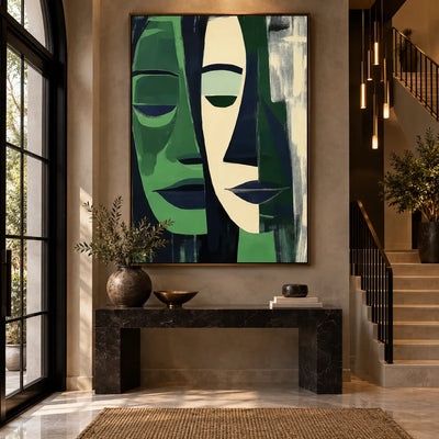 Two Faces in Forest Green: above a black marble console beside a staircase and slim pendant lights