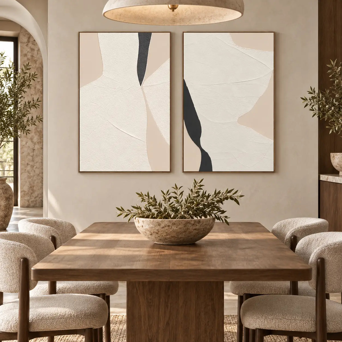 Two Openings in Cream: paired behind a wood dining table beneath a wide pale pendant