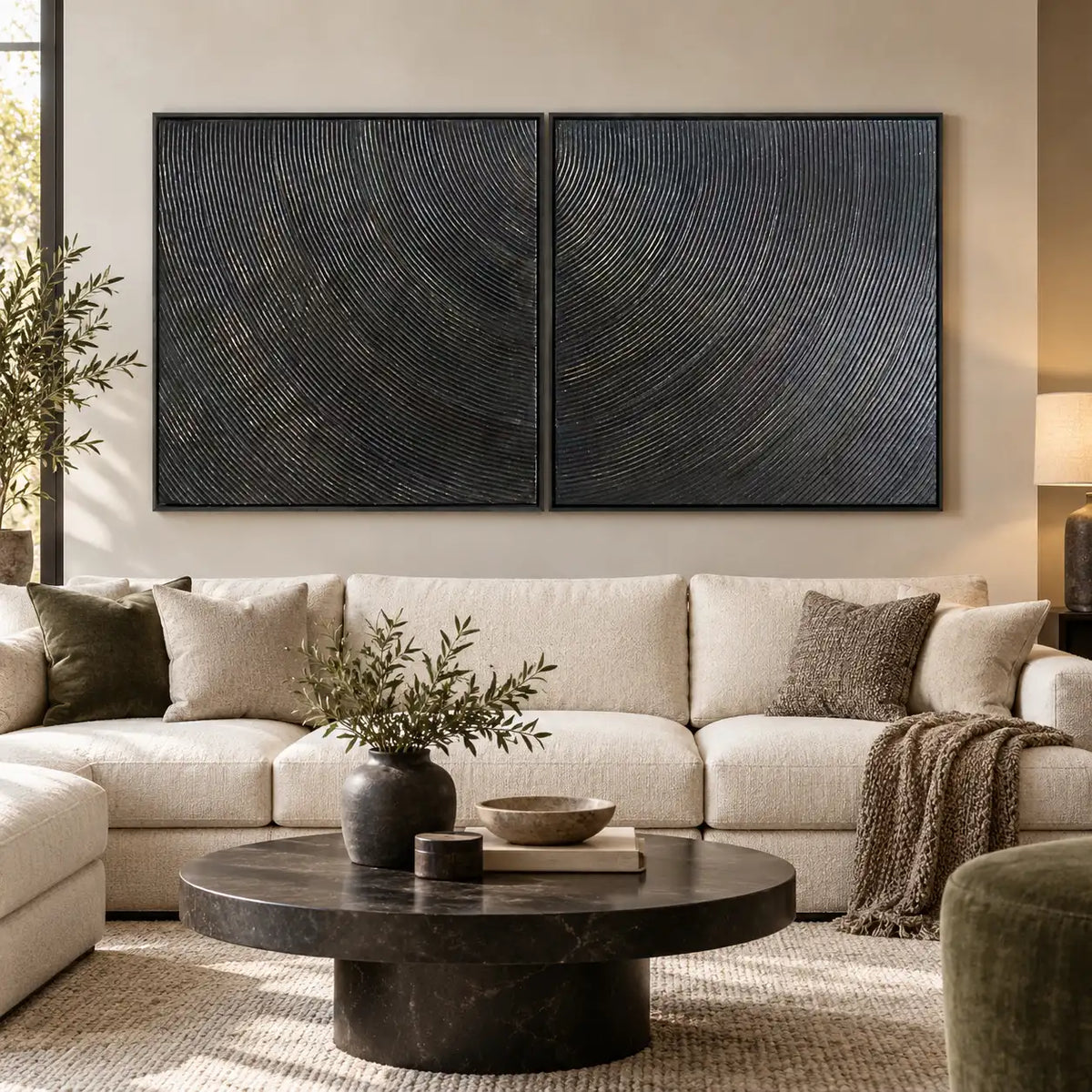 Two Rhythms in Charcoal: paired above a cream sectional with a round dark marble table