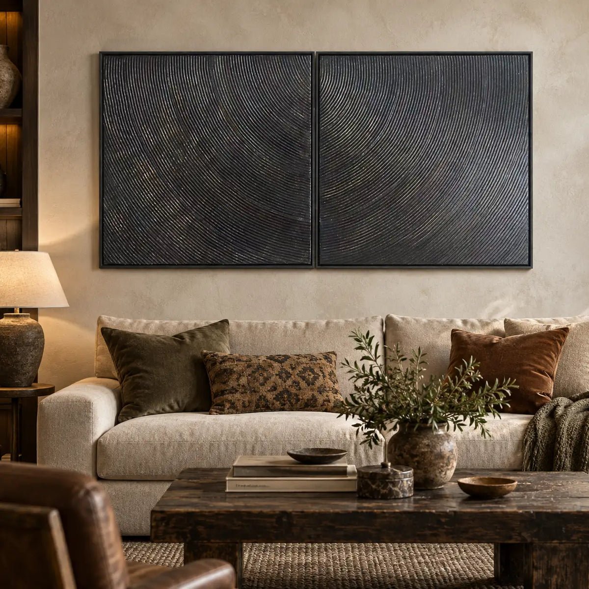 Two Rhythms in Charcoal: paired above a cream sofa with olive and rust cushions and a rustic table