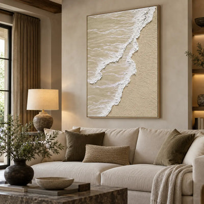 Two Tides on Pale Sand: above a cream sofa with olive cushions beside wood shelves