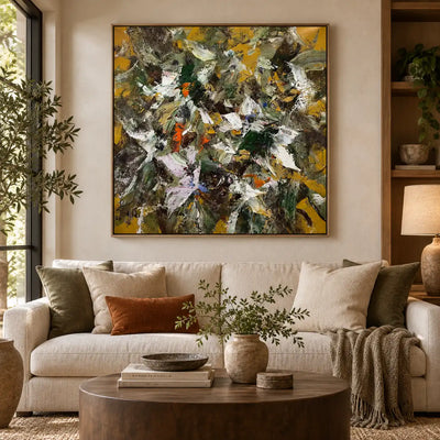 Under an Ochre Canopy: above a cream sofa with olive cushions beside wooden shelves