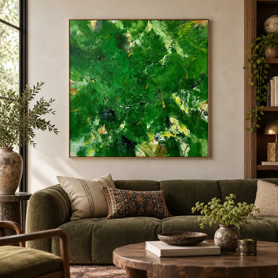 Verdant Immersion: above an olive sofa beside bookshelves and patterned cushions