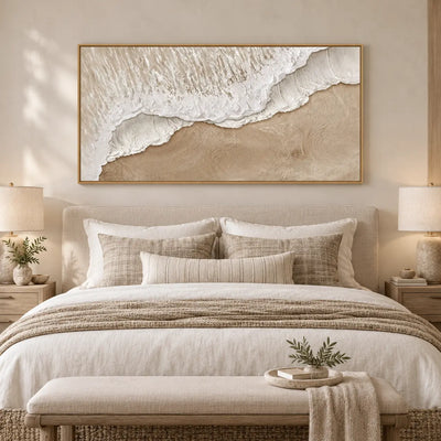 Where Foam Meets Sand: above a linen bed and pale wood bench with a leafy tray