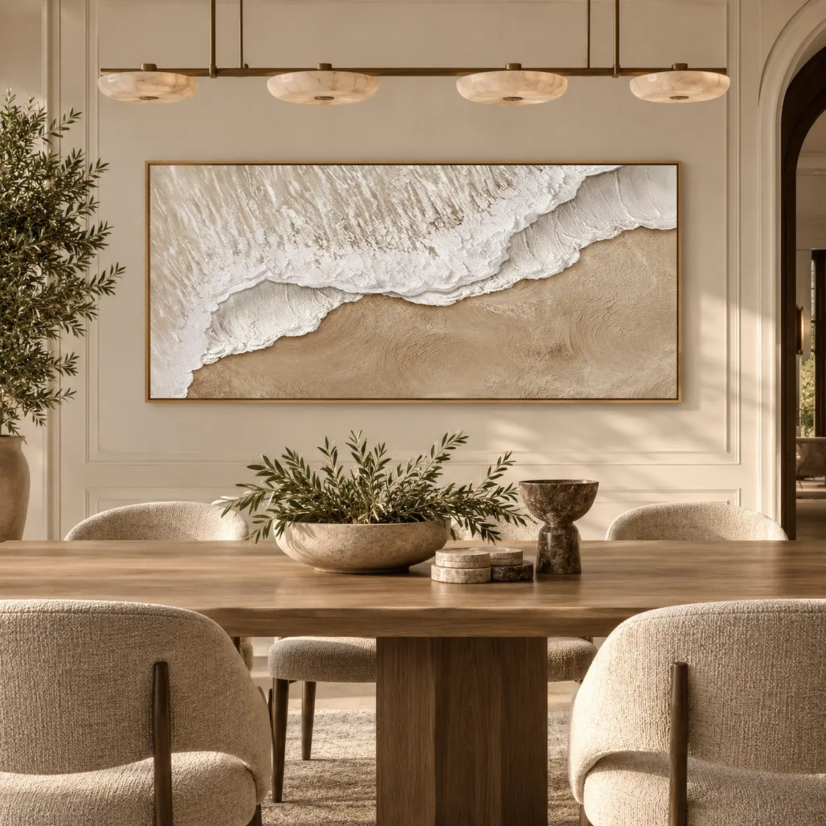 Where Foam Meets Sand: behind a wood dining table beneath four shallow pendant shades