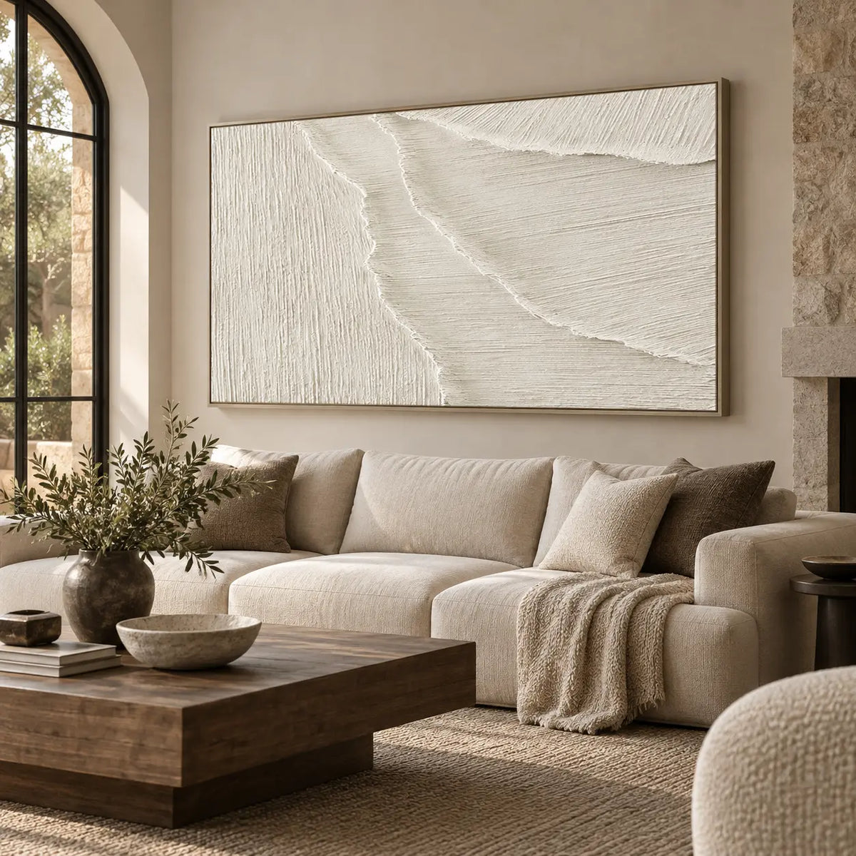 Where the Fine Lines Turn: above a cream sofa beside an arched window and stone fireplace