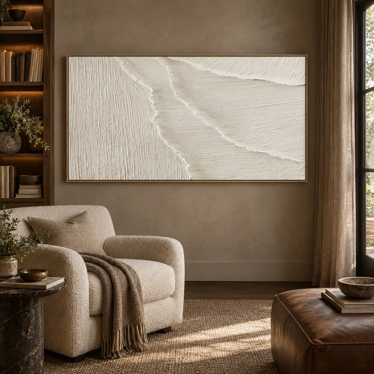 Where the Fine Lines Turn: in a reading room with a cream armchair and brown leather ottoman