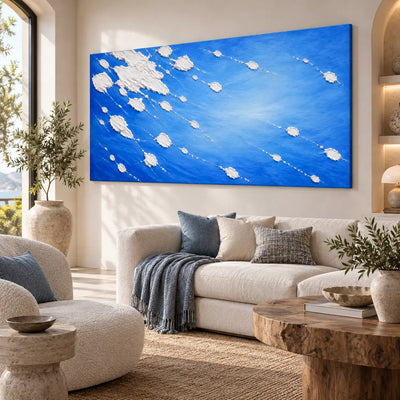 White Traces in Cobalt: angled above a cream sofa with blue patterned cushions