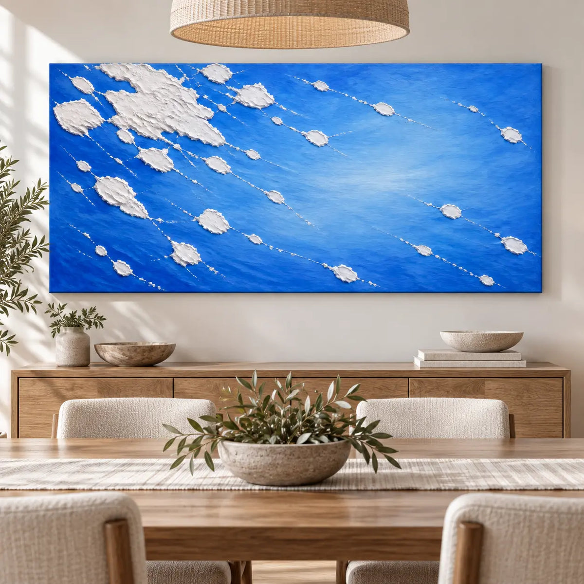 White Traces in Cobalt: above a dining sideboard behind an oak table beneath a rattan pendant