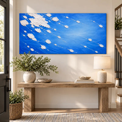 White Traces in Cobalt: above a wood console with a cream lamp beside a staircase