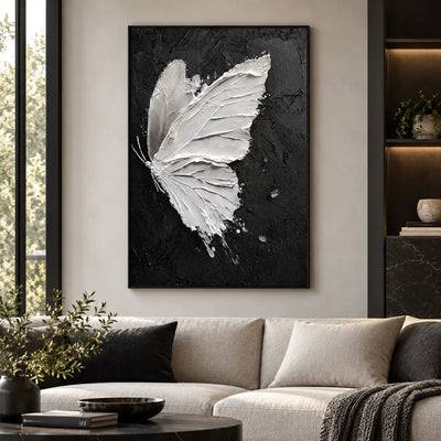 Wings Against Midnight: above an ivory sofa with dark cushions and a round black table