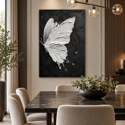 Wings Against Midnight: behind a dark dining table beneath a glass globe fixture